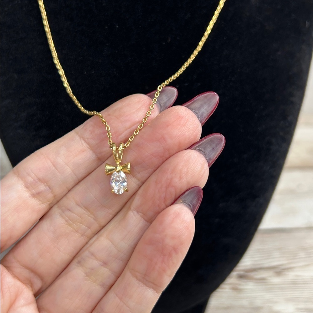 Elegant Gold Necklace with Cross Bow Pendant